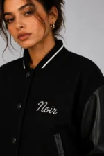 Buy Noir Script Embroidered Cropped Varsity Jacket Women All Black