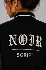 Buy Noir Script Embroidered Cropped Varsity Jacket Women Black